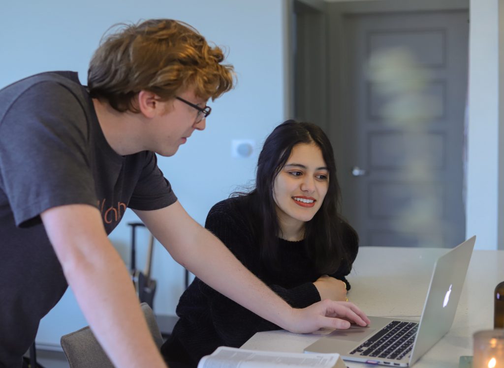 people looking at a computer screen